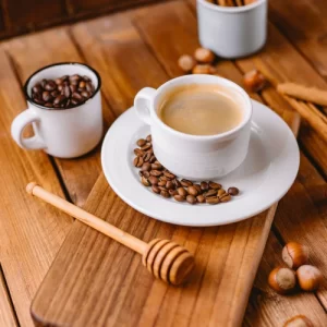 coffee cup decorated with coffee beans placed wooden serving board vertical 141793 1886 coffee-cup-decorated-with-coffee-beans-placed-wooden-serving-board-vertical_141793-1886