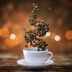 coffee cup with coffee beans on wooden table e1625191331141 coffee-cup-with-coffee-beans-on-wooden-table--e1625191331141